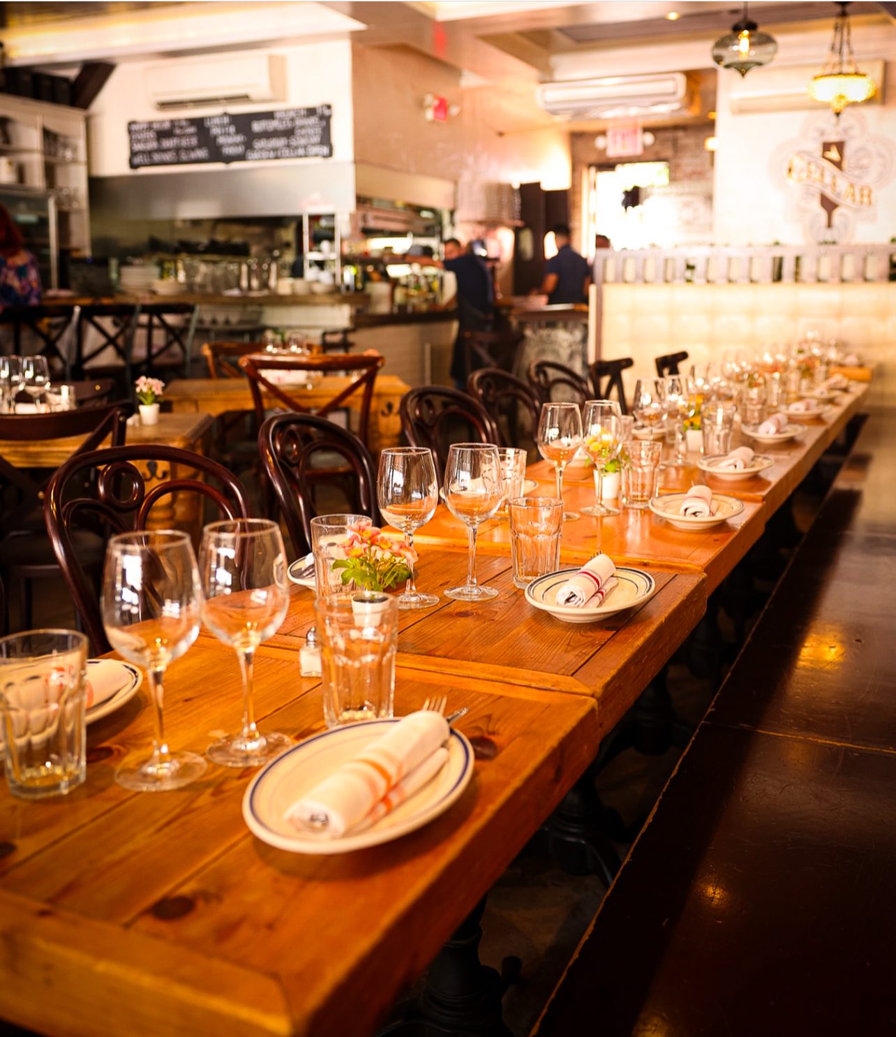 Long table set for a group in Medi's main dining room